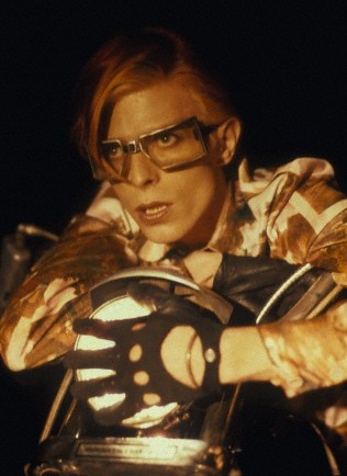 David Bowie sitting on a motorcycle
